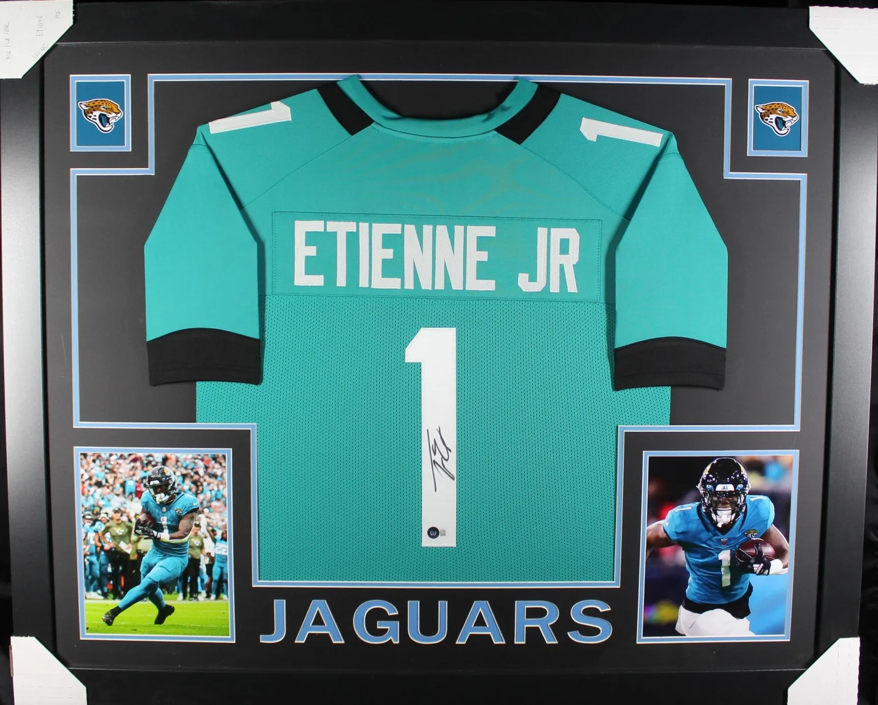 Travis Etienne framed autographed teal jersey